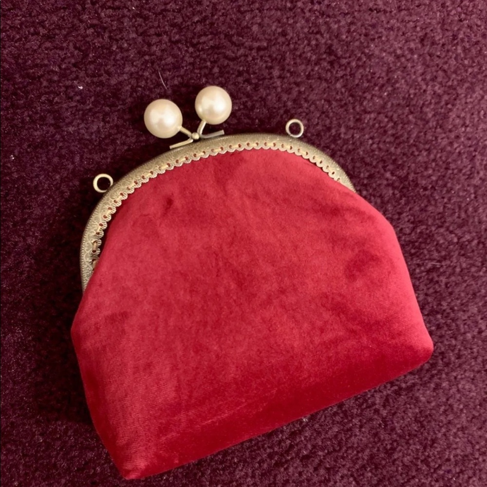 Red suede clutch with pink lining inside